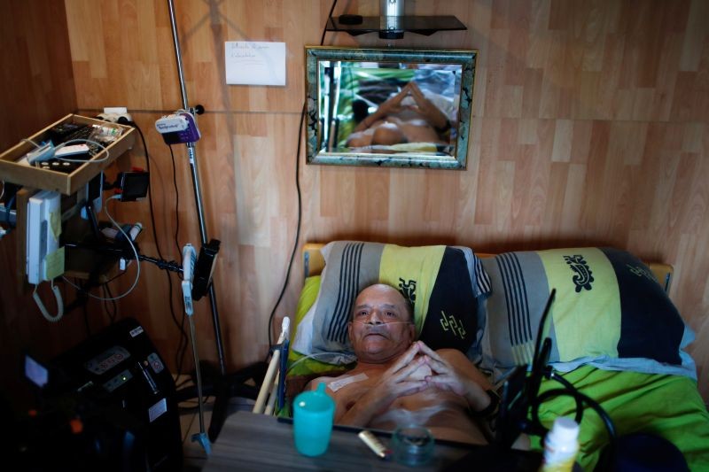 Alain Cocq, 57, in his medical bed he has been confined to for years as a result of a degenerative disease that has no treatment, poses after an interview with Reuters at his home in Dijon, France on August 19, 2020. (REUTERS Photo)