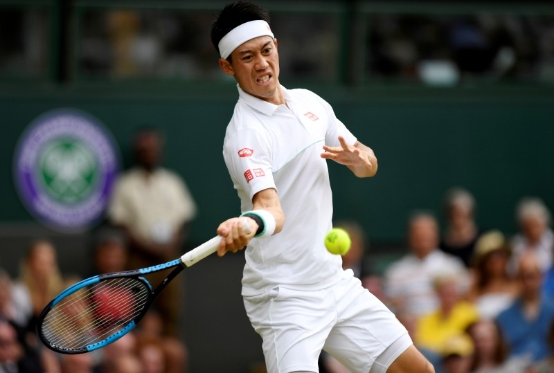 FILE PHOTO: Tennis - Wimbledon - All England Lawn Tennis and Croquet Club, London, Britain - July 10, 2019 Japan's Kei Nishikori in action during his quarter final match against Switzerland's Roger Federer REUTERS/Tony O'Brien/File Photo