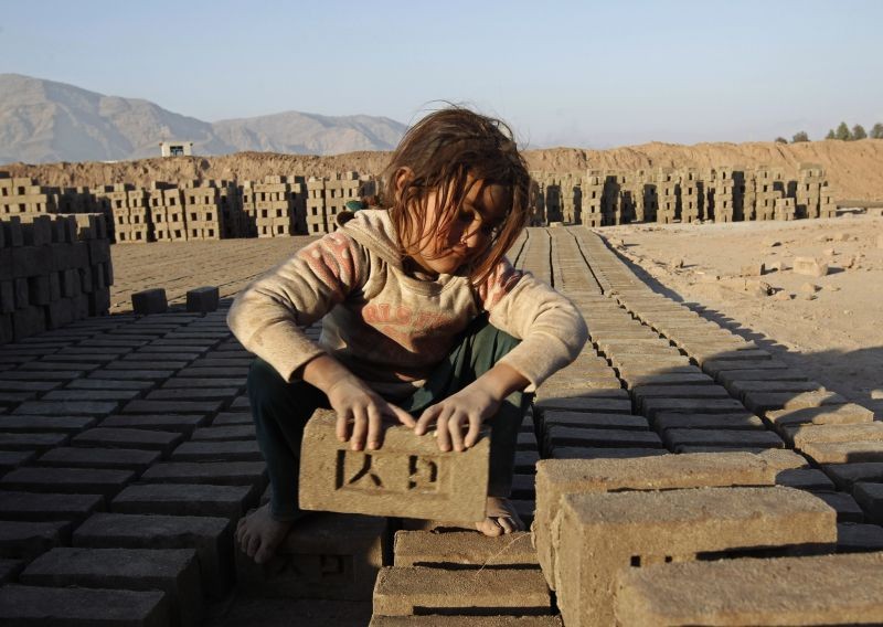 An Afghan girl works at a brick-making factory in Nangarhar province January 6, 2015.  (REUTERS File Photo)