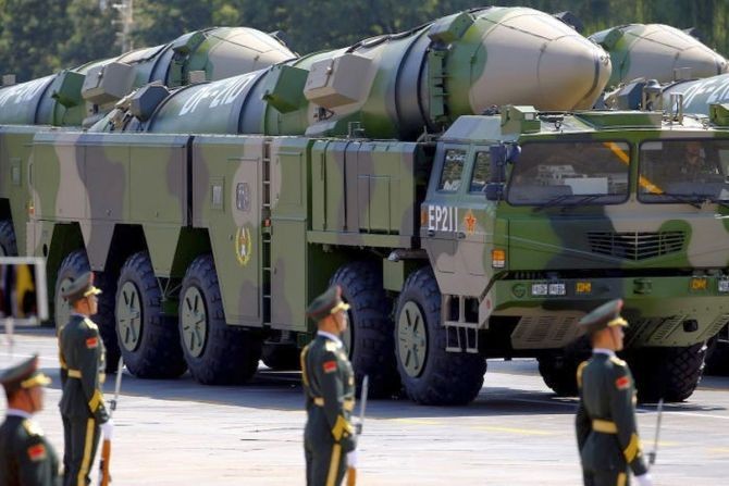 Military vehicles with DF-21D ballistic missiles head to Tiananmen Square during a military parade in Beijing. Photograph: Damir Sagolj/Reuters
