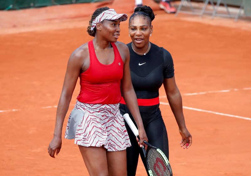 Tennis - French Open - Roland Garros, Paris, France - May 30, 2018    Serena Williams and Venus Williams of the U.S. celebrate after winning their first round doubles match against Japan's Shuko Aoyama and Miyu Kato   REUTERS/Charles Platiau/File Photo