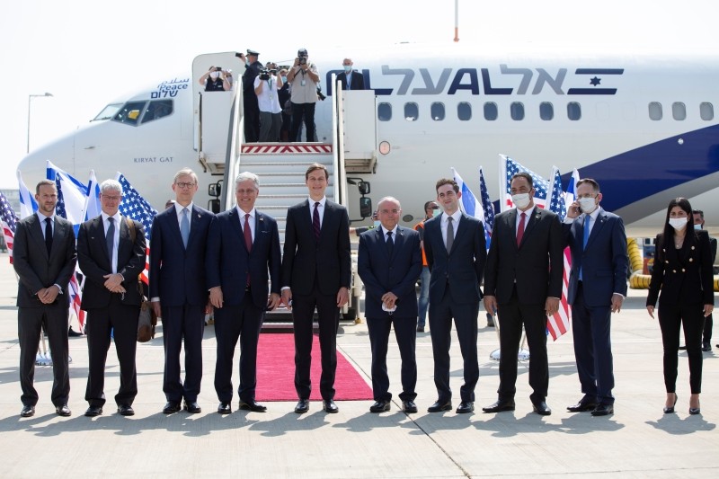 Senior U.S. Presidential Adviser Jared Kushner and U.S. National Security Adviser Robert O'Brien pose with members of the Israeli-American delegation before the departure to Abu Dhabi, at Ben Gurion Airport, near Tel Aviv, Israel August 31, 2020. Heidi Levine/Pool via REUTERS