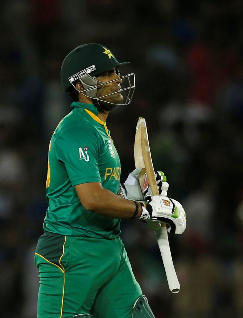 FILE PHOTO: Pakistan's Umar Akmal walks off the field after his dismissal. REUTERS/Adnan Abidi/File Photo