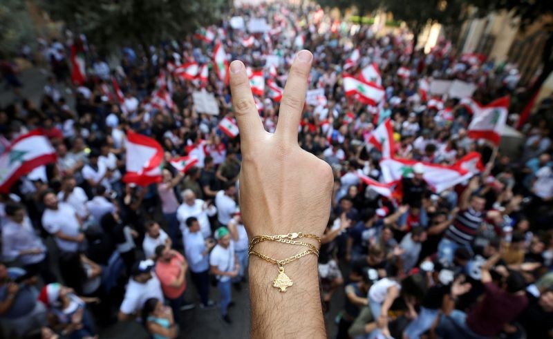 A demonstrator flashes a V sign during an anti-government protest in downtown Beirut, Lebanon October 21, 2019. (REUTERS File Photo)