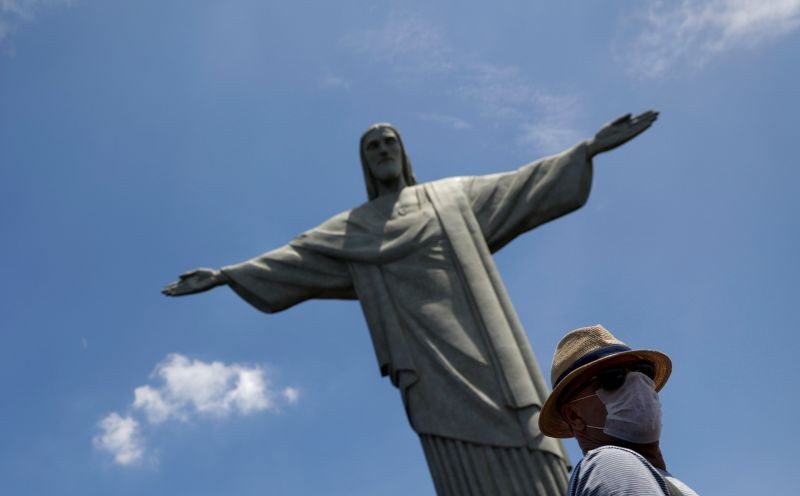 A tourist wearing a protective face mask is pictured during a visit to Christ the Redeemer statue after reports of coronavirus in Rio de Janeiro, Brazil on March 16, 2020. (REUTERS File Photo)