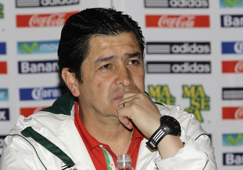 Mexico's coach Luis Fernando Tena listens to a journalist's question during a news conference upon his arrival at the international airport in Mexico City August 12, 2012. REUTERS/Henry Romero/Files