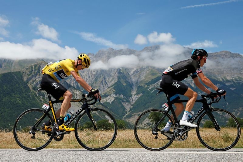 FILE PHOTO: Team Sky riders Geraint Thomas of Britain and Chris Froome of Britain (L), race leader's yellow jersey, cycle during the 186.5-km (115.88 miles) 18th stage of the 102nd Tour de France cycling race from Gap to Saint-Jean-de-Maurienne in the French Alps mountains, France, July 23, 2015. REUTERS/Benoit Tessier/File Photo