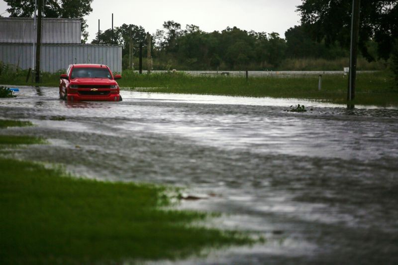 A car near Vermilion Bay is seen partially submerged in waters brought by Hurricane Laura approaching Abbeville, Louisiana, US on August 26, 2020.  (REUTERS Photo)