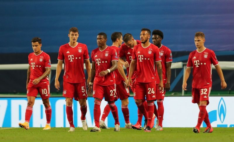 Bayern Munich's Robert Lewandowski celebrates scoring their third goal with teammates, as play resumes behind closed doors following the outbreak of the coronavirus disease (COVID-19) Miguel A. Lopes/Pool via REUTERS