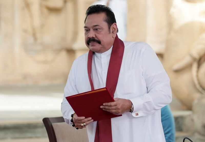 Sri Lanka's former leader Mahinda Rajapaksa is seen after reading his oaths as the new Prime Minister in front of his brother and Sri Lanka's President Gotabaya Rajapaksa during the swearing in ceremony at Kelaniya Buddhist temple in Colombo, Sri Lanka on August 9, 2020. (REUTERS Photo)