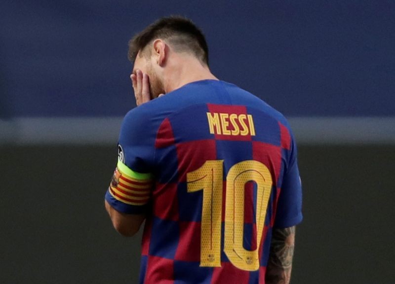 FILE PHOTO: Barcelona's Lionel Messi looks dejected, as play resumes behind closed doors following the outbreak of the coronavirus disease (COVID-19) Manu Fernandez/Pool via REUTERS