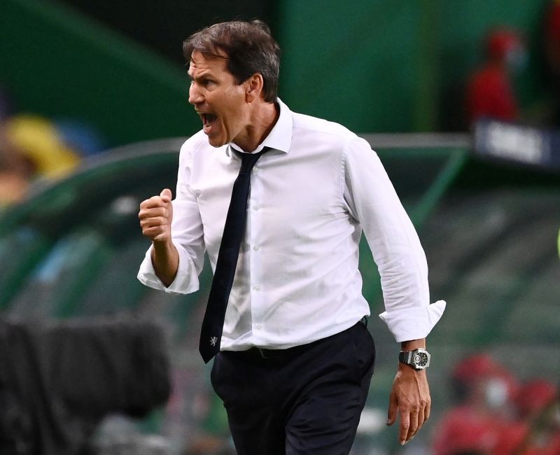 Olympique Lyonnais coach Rudi Garcia celebrates after Moussa Dembele scored their third goal, as play resumes behind closed doors following the outbreak of the coronavirus disease (COVID-19) Franck Fife/Pool via REUTERS