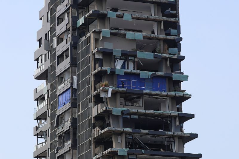 A man is seen on the balcony of a destroyed building, following a massive explosion, in Beirut, Lebanon on August 12. (REUTERS Photo)