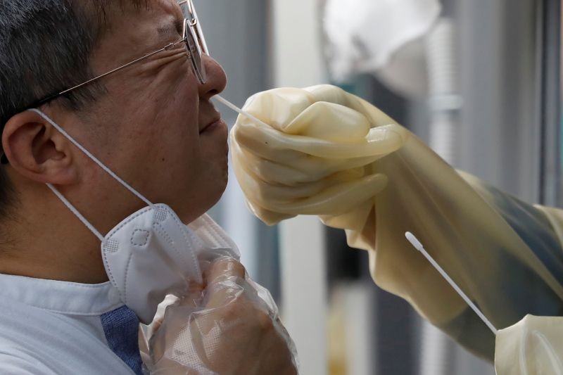 A man undergoes a coronavirus disease (COVID-19) test at a makeshift clinic in Seoul, South Korea on August 26, 2020. (REUTERS File Photo)