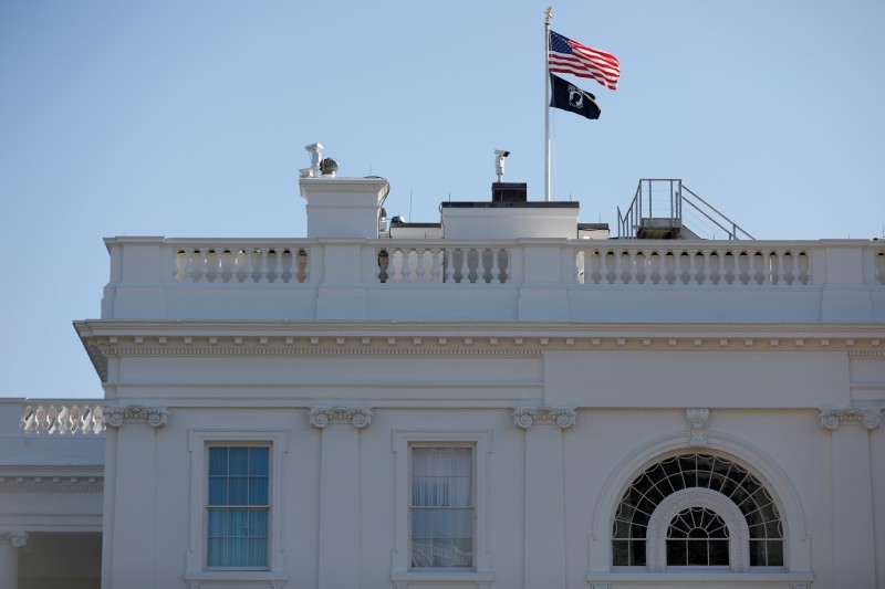 A Prisoner Of War-Missing In Action flag flies below the American Flag at the White House ahead of U.S. President Trump's meeting with Turkish President Tayyip Erdogan, in Washington, U.S., November 13, 2019. REUTERS/Tom Brenner/File Photo