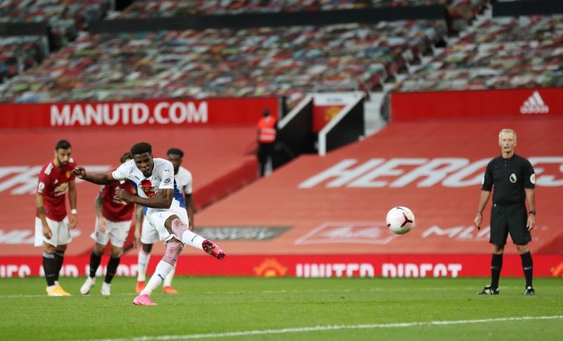 Crystal Palace's Wilfried Zaha scores their second goal from the penalty spot after the penalty was retaken due to Manchester United's David De Gea coming off his line Pool via REUTERS/Martin Rickett