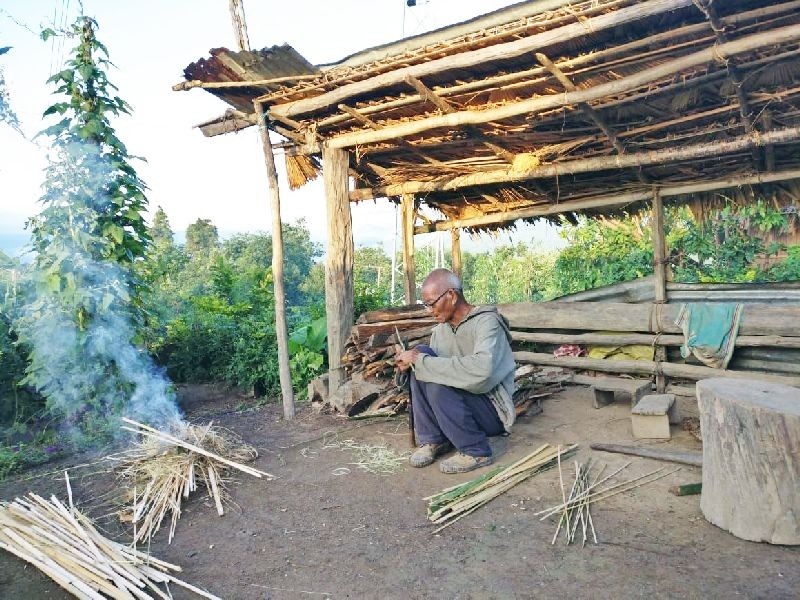 An elderly man in the process of splitting bamboo to make baskets and other items in Ekhao village under Pathso EAC headquarters in Noklak district on September 19. (Morung Photo)