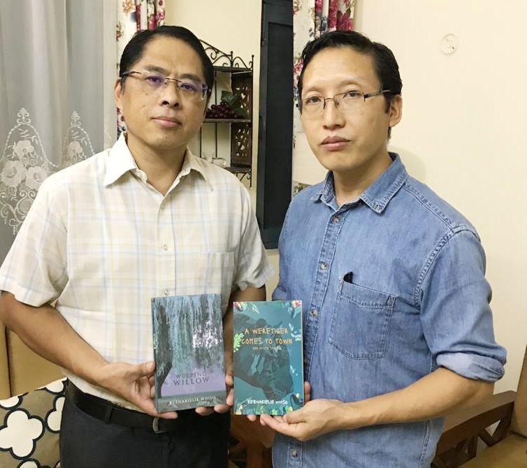 Er Talimoa Jamir, DGM (Electronics & Communications) (L) seen with Kezhakielie Whiso during the release of the books on September 10.
