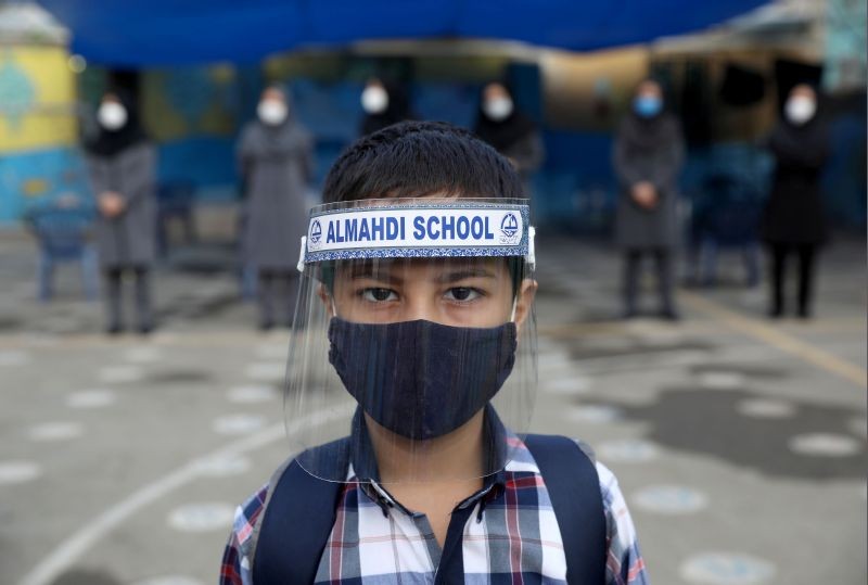 A student wearing a protective face mask and shield to help prevent the spread of the coronavirus disease (COVID-19), looks on as he poses for a picture at Al-Mahdi school in Tehran, Iran September 5, 2020.(REUTERS File Photo)