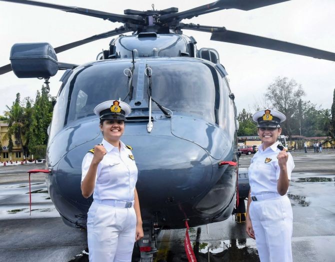 Sub Lt Riti Singh and Sub Lt Kumudini Tyagi, the first women airborne tacticians who will operate from deck of warships, pose for pictures after they passed out of Indian Navy's Observer Course, at Southern Naval Command, Kochi. Photograph: PTI Photo