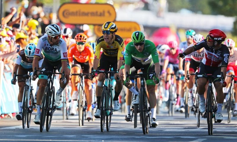 BORA-Hansgrohe rider Peter Sagan of Slovakia, Team Jumbo-Visma rider Wout Van Aert of Belgium, Deceuninck-Quick Step rider Sam Bennett of Ireland, wearing the green jersey, and stage winner Lotto Soudal rider Caleb Ewan of Australia react after the finish. Pool via REUTERS/Thibault Camus