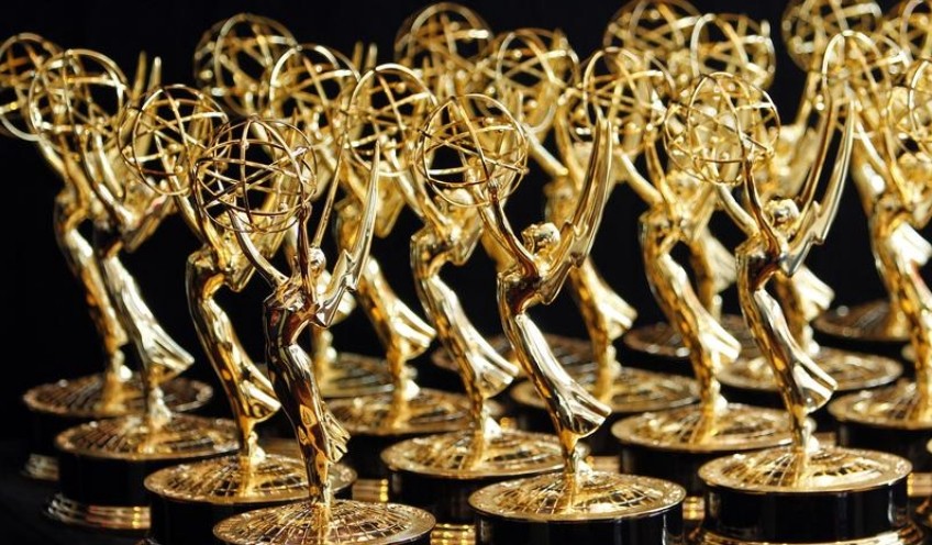 FILE PHOTO: Dozens of Emmy Awards are lined up on the trophy table in the media center at the 62nd annual Primetime Emmy Awards in Los Angeles, California August 29, 2010. REUTERS/Danny Moloshok