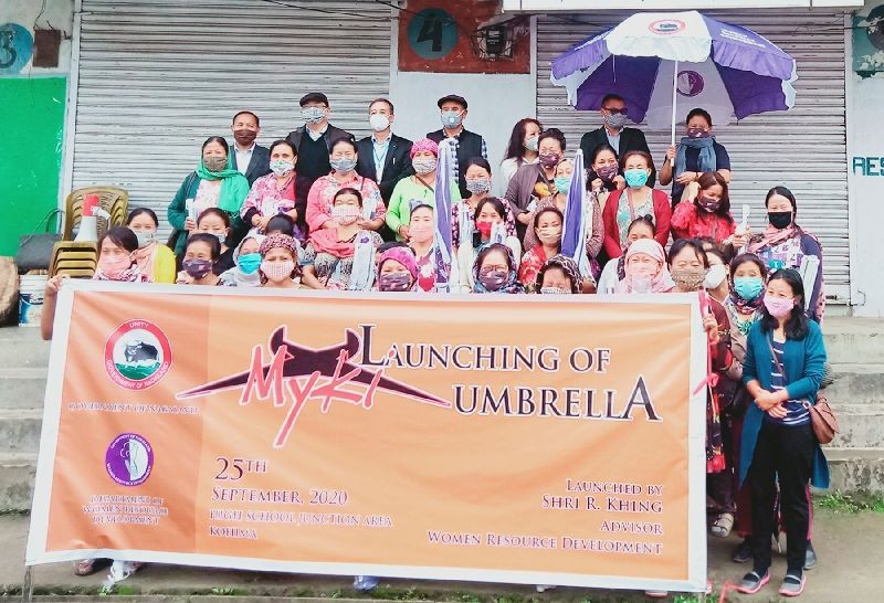 R Khing Advisor, Women Resource Development and others with women vegetable vendors during the launch of umbrella distribution programme in Kohima on September 25. (Morung Photo)