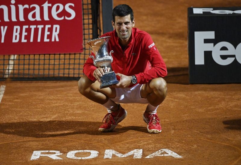 Serbia’s Novak Djokovic celebrates with the trophy after winning the Italian Open  final against Argentina’s Diego Schwartzman at Foro Italico, Rome on September 21. (REUTERS Photo)