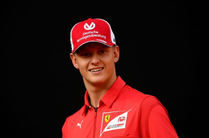 FILE PHOTO: Racing driver Mick Schumacher attends an event to celebrate 90 years of Italian premium sports car maker Ferrari racing team at Milan's Duomo square, in Milan, Italy September 4, 2019. REUTERS/Flavio lo Scalzo/File Photo/File Photo