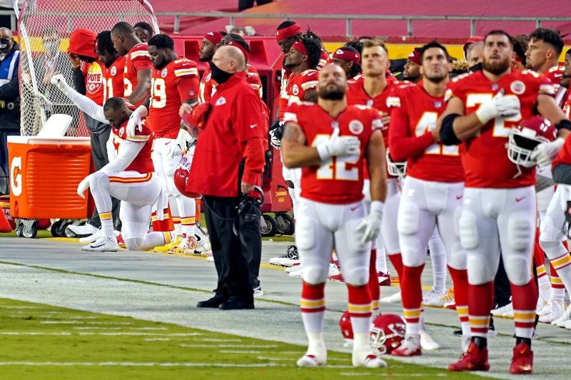 Kansas City Chiefs defensive end Alex Okafor (97) kneels for the national anthem before the game against the Houston Texans at Arrowhead Stadium. Denny Medley-USA TODAY Sports