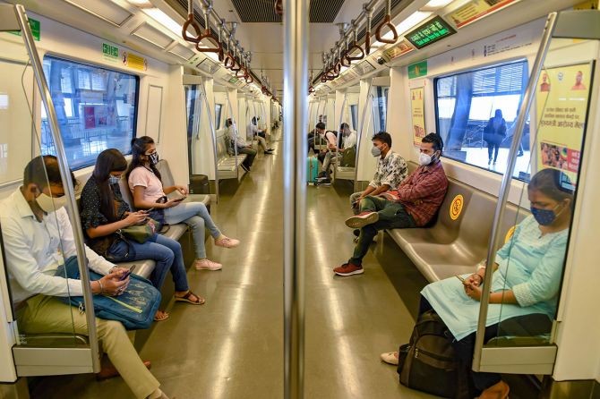 Commuters travel in a metro train after Delhi Metro resumed services with curtailed operation of the Yellow Line and Rapid Metro, amid the ongoing coronavirus pandemic, in New Delhi. Photograph: Atul Yadav/PTI Photo