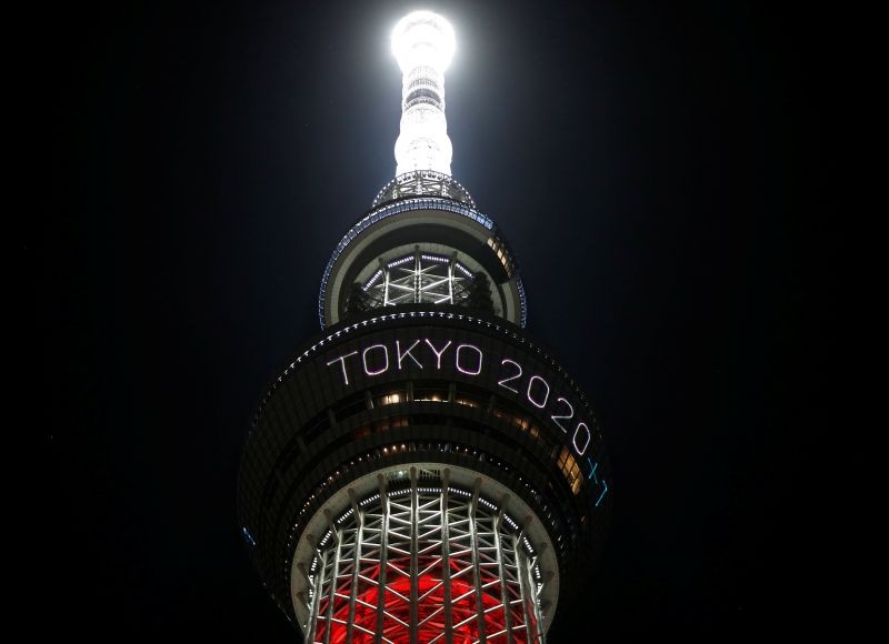 The message reading "Tokyo 2020 +1" is displayed while the Tokyo Skytree lights up in Paralympic symbol colours on the day marking the one-year countdown to the games that have been postponed to 2021 due to the coronavirus disease (COVID-19) outbreak, in Tokyo, Japan August 24, 2020. REUTERS/Issei Kato/Files