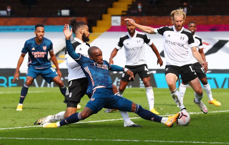 Arsenal's Alexandre Lacazette in action with Fulham's Michael Hector and Tim Ream Pool via REUTERS/Clive Rose