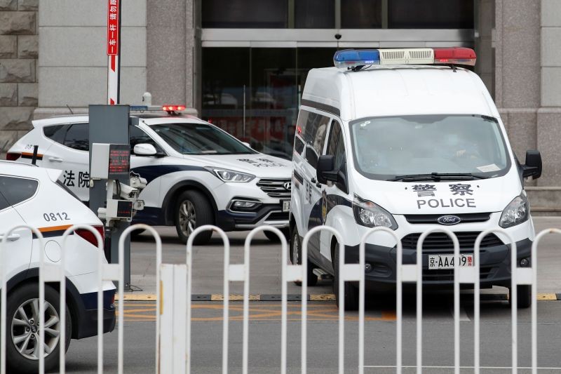 An escorted police van believed to be carrying Huayuan Real Estate Group former chairman Ren Zhiqiang leaves Beijing No. 2 Intermediate People's Court, where Ren faces corruption trial, in Beijing, China September 11, 2020. (REUTERS File Photo)