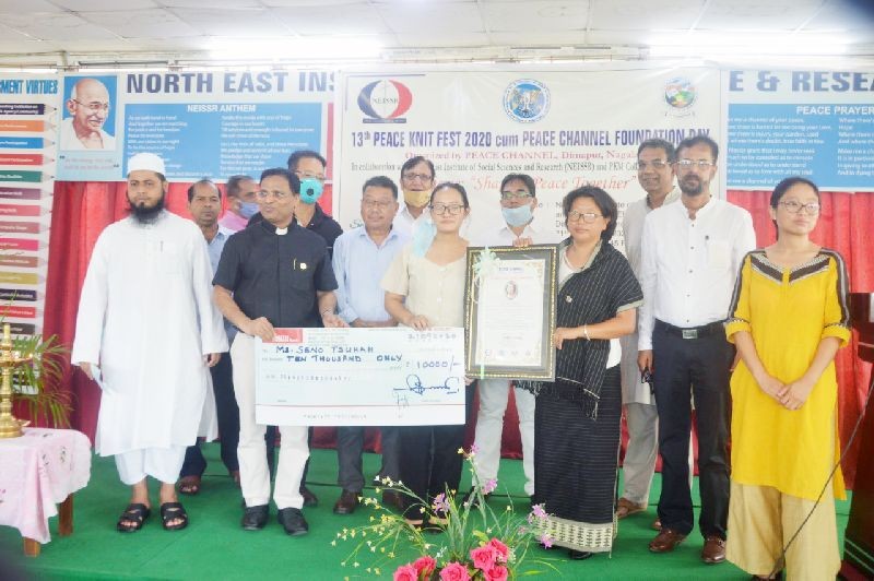 Recipient of 13th Peace Knit Fest, Seno Tsuhah with others during the function held at NEISSR, Conference Hall, Dimapur on September 21. (Photo Courtesy: Peace Channel)