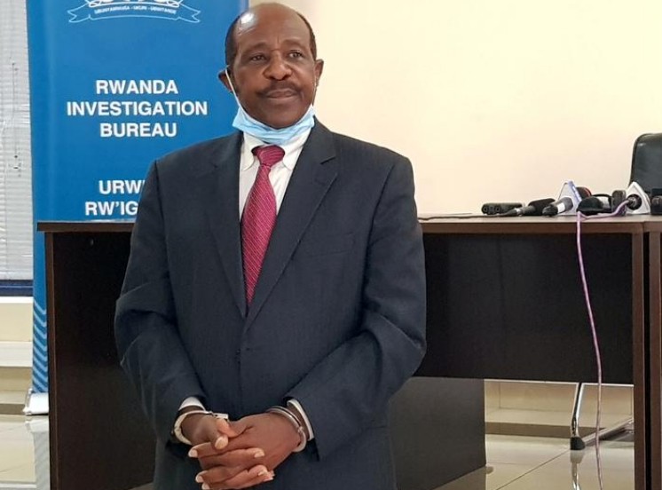 FILE PHOTO: Paul Rusesabagina, the man who was hailed a hero in a Hollywood movie about the country's 1994 genocide is detained and paraded in front of media in handcuffs at the headquarters of Rwanda Investigation Bureau in Kigali, Rwanda August 31, 2020. REUTERS/Clement Uwiringiyimana/File Photo