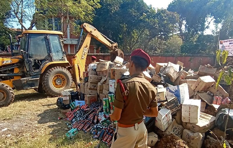 Confiscated contrabands including assortment of liquors and codeine-based cough syrups bottles are seen in this file photo taken during the disposal of such seized items by the Directorate of Excise, Nagaland, in November 2019. (Morung File Photo)