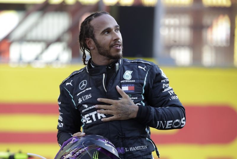 Mercedes' Lewis Hamilton celebrates after winning the race on September 13. Pool via REUTERS/Luca Bruno