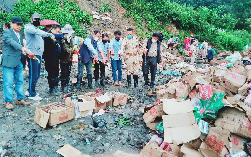 Advisor Zhaleo Rio and others during the destruction of seized liquor on September 25 in Kohima. (Morung Photo)