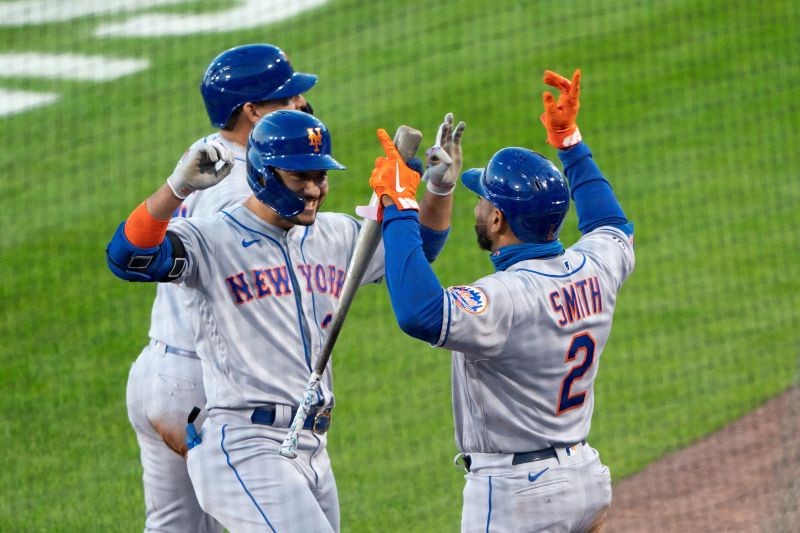 FILE PHOTO: New York Mets first baseman Dominic Smith (2) congratulates Mets right fielder Michael Conforto (30) for hitting a three run home run during the third inning against the Toronto Blue Jays at Sahlen Field. Sep 11, 2020; Buffalo, New York, USA; Gregory Fisher-USA TODAY Sports/File Photo