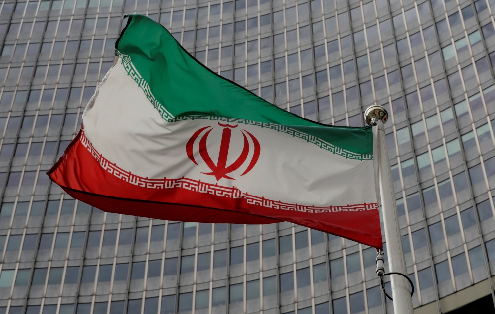 An Iranian flag flutters in front of the International Atomic Energy Agency (IAEA) headquarters in Vienna, Austria September 9, 2019. REUTERS/Leonhard Foeger/Files