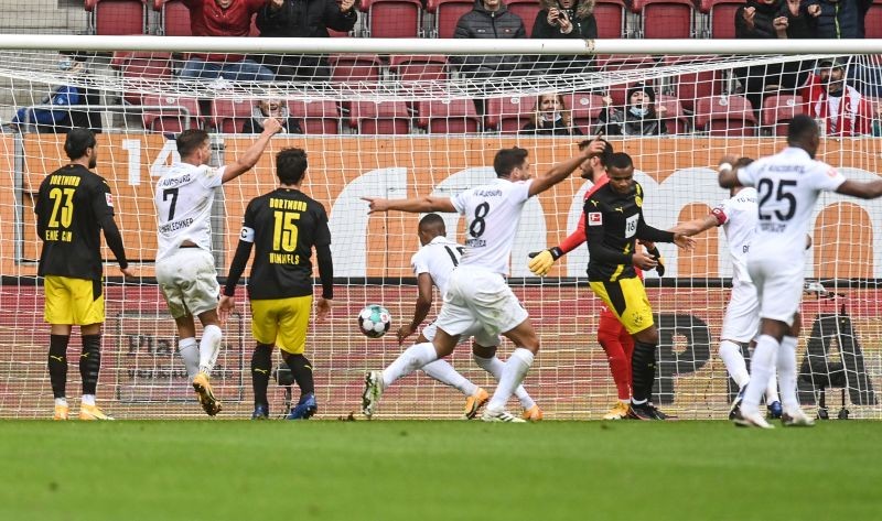 Augsburg's Felix Uduokhai (not pictured) celebrates scoring their first goal on September 26. Christof Stache/Pool via REUTERS