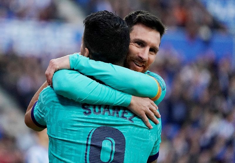 FILE PHOTO: Soccer Football - La Liga Santander - Real Sociedad v FC Barcelona - Anoeta Stadium, San Sebastian, Spain - December 14, 2019   Barcelona's Luis Suarez celebrates scoring their second goal with Lionel Messi    REUTERS/Vincent West/File Photo