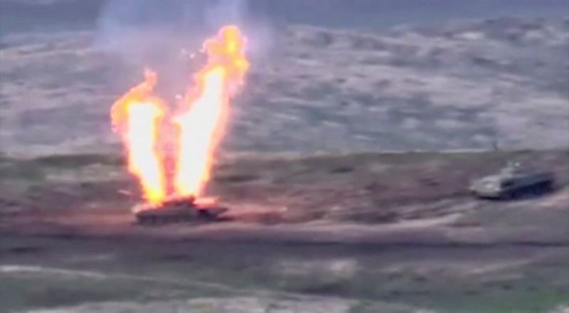 A still image from a video released by the Armenian Defence Ministry shows what is said to be Azerbaijani armoured vehicles, one of which is destroyed by Armenian armed forces in the breakaway region of Nagorno-Karabakh, in this still image from footage released on September 27, 2020. (REUTERS Photo)