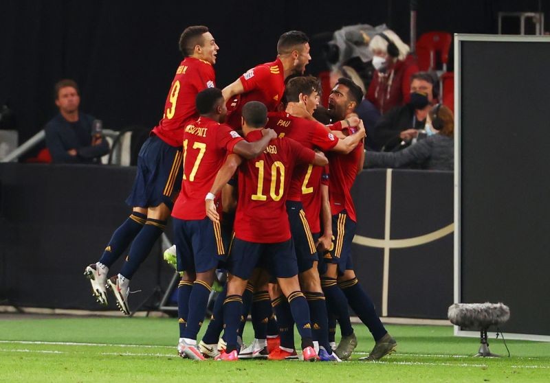 Spain's Gaya celebrates scoring their first goal with teammates REUTERS/Kai Pfaffenbach