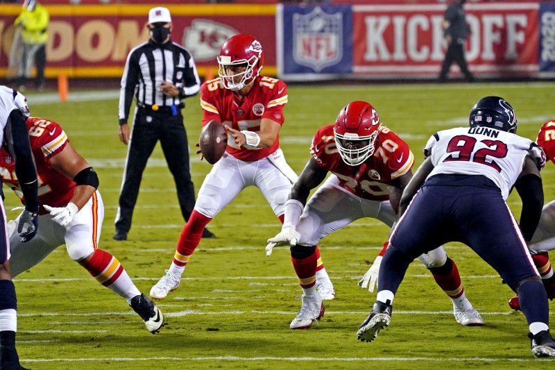 Kansas City Chiefs quarterback Patrick Mahomes (15) takes a snap during the first half against the Houston Texans at Arrowhead Stadium. Denny Medley-USA TODAY Sports