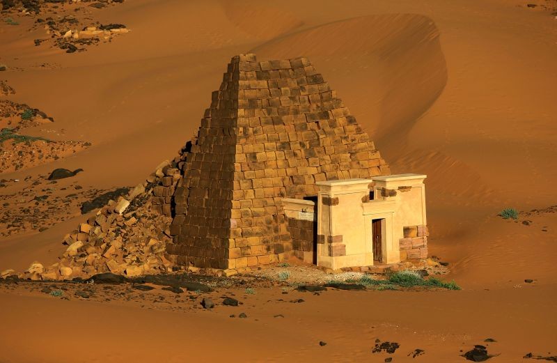 Creeping desert sands surround the Royal Cemeteries of Meroe Pyramids in Begrawiya at River Nile State, Sudan on November 10, 2019. (REUTERS File Photo)