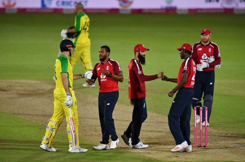 Australia's Mitchell Marsh with England's Chris Jordan after winning the match Glyn Kirk/Pool via REUTERS