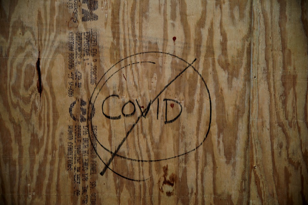 FILE PHOTO: A shop windows are seen covered with plywood as the spread of the coronavirus disease (COVID-19) continues, in New Orleans, Louisiana U.S., April 11, 2020. (REUTERS/Carlos Barria/File Photo)