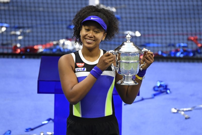 Naomi Osaka of Japan celebrates with the championship trophy after her match against Victoria Azarenka of Belarus (not pictured) in the women's singles final on day thirteen of the 2020 U.S. Open tennis tournament at USTA Billie Jean King National Tennis Center. Danielle Parhizkaran-USA TODAY Sports